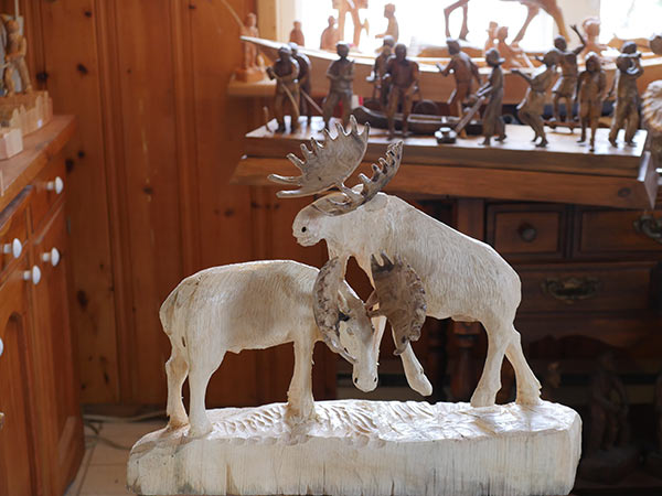 Carving of 2 bullmoose fighting